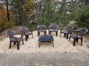 Fire pit near front door with easy access to firewood