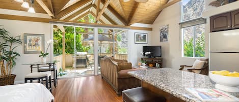 The Weiskopf Suite with vaulted ceilings & large windows overlooking the pool.