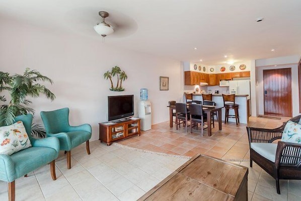 The condo has is long and narrow with the kitchen, dining, and living area in one large space