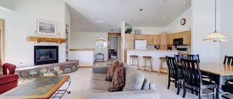 Large, open concept living, kitchen, and dining area on the upper level of the home.