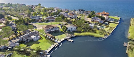 Arial view shows location of property on a private boat basin to Moriches Bay
