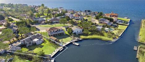 Arial view shows location of property on a private boat basin to Moriches Bay