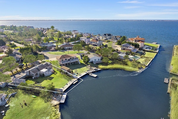 Arial view shows location of property on a private boat basin to Moriches Bay