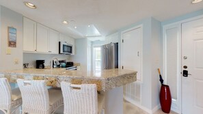 Kitchen with Granite and Bar Seating for Three