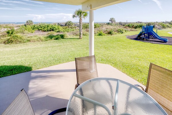 Private Patio - Oceanfront patio features a table with seating for four and an electric grill for outdoor barbequing. Perfect spot to relax and unwind!