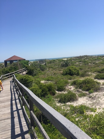 Private boardwalk to beach with secured entry.