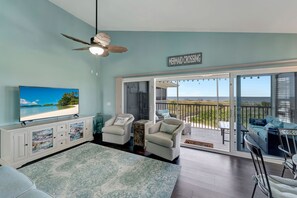 Ocean View Living Room in Beachfront Condo - Elegant living room with ocean view in Palm Island beach house, ideal for beachfront rentals.