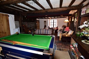 Main lounge with wood-burner & pool table