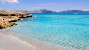 Playa de Sant Pere with white sand and turquoise water.