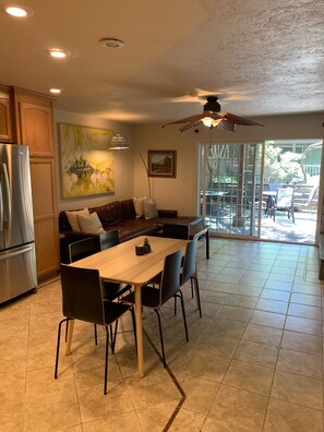 6 person table, fireplace we supply wood, 110 inch resto cozy couch! Rug added.