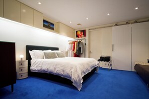 Luxury bed in spacious bedroom
