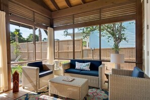 Large screened in porch on back of house.