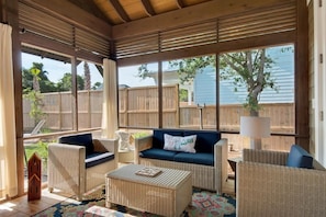 Large screened in porch on back of house.