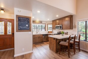 Open floor plan with sparkling clean functional kitchen.