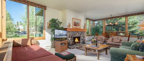 Living Room with Wood Fireplace and Window Beds