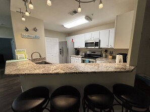 Kitchen and adjacent laundry room.