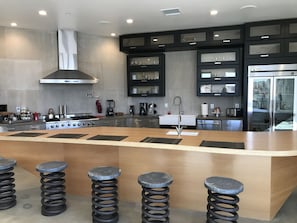 Huge Counter with Bar Stools and Chef Appliances 