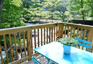 Relax on the deck overlooking the waterfall and a beautiful gorge below.
