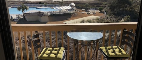 Imagine sitting on this balcony overlooking this beautiful pool and ocean!