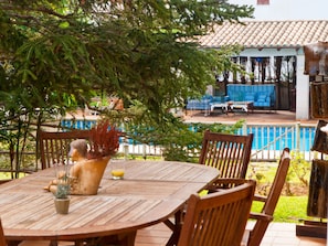 Terrace with views of the garden and pool