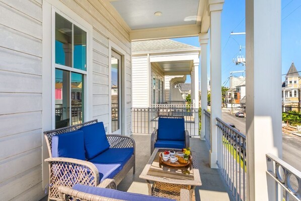 Balcony with outdoor sitting area in the evening