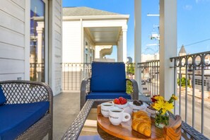 Balcony with outdoor sitting area in the evening