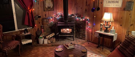 Cozy front room with wood burning stove.