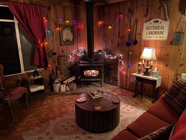 Cozy front room with wood burning stove.