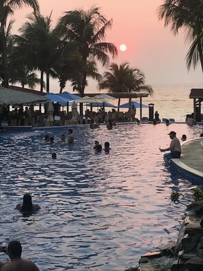 Every night a beautiful sunset. Night swimming in 2 Infinity pools