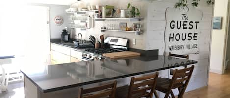 Enjoy two different dining areas, and large quartz countertop for meal prepping!