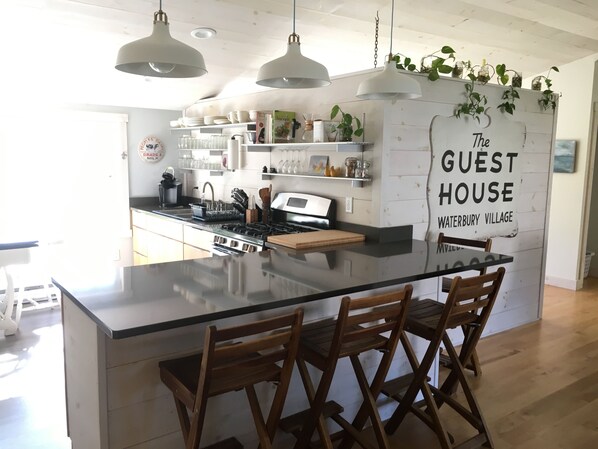 Enjoy two different dining areas, and large quartz countertop for meal prepping!