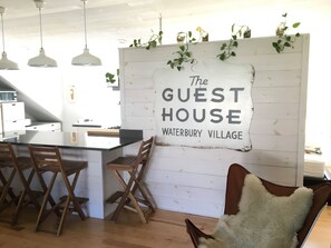 The historic 1900's Guest House sign has a prominent location.