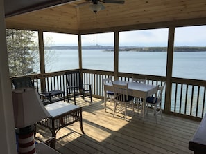 Large screened porch overlooking ocean w/ couch, dining. Enter from LR or MBR