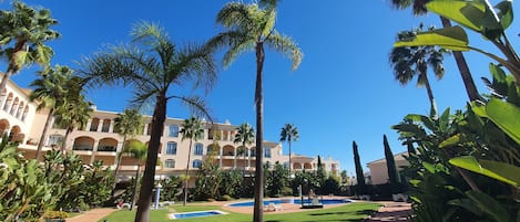 View of garden area & two swimming pools