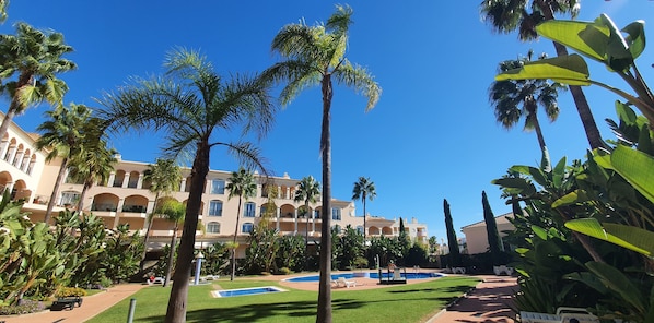 View of garden area & two swimming pools