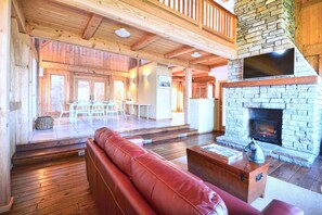 Living room, Dining room, fireplace and big flat screen tv