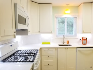 New bright, clean, cheerful kitchen. Everything you need.