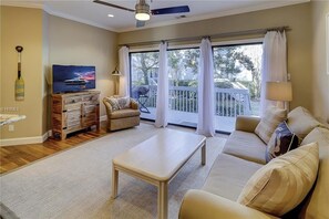 Living Room - This comfy open living space is perfect for family get togethers. Complete with a back deck and electric barbecue.