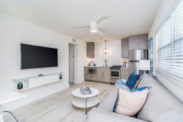 Modern, coastal decor with a 55" flat screen TV