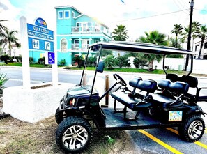 We are right at the Beach Access with a 6 seater golf cart