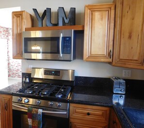 Kitchen with Samsung Gas stove/oven/microwave