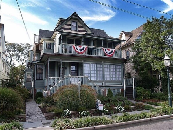 Front view -our unit includes the seating porch and windowed sunroom first floor