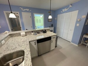 Second bedroom and main bathroom is off kitchen