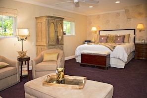 King bed, plush bedding, TV armoire 