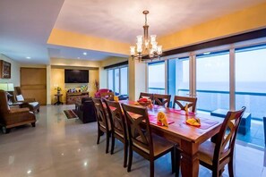 Comfortable living room with adjoining dining room. Both with ocean views.