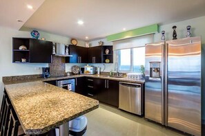 Fully equipped kitchen with all major small and large appliances