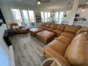 New leather sectional with smart TV, and electric fireplace for cozy nights 