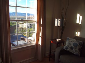 Living room in 208 looking out onto the shared deck.