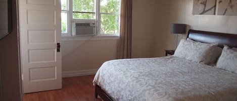 Bedroom looking out into the trees in 208.