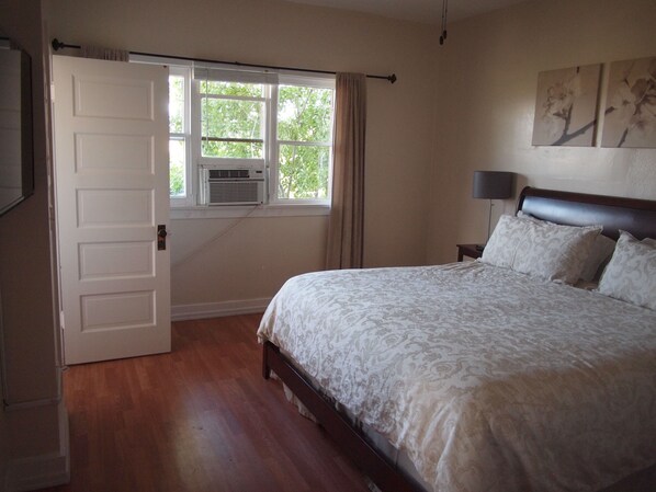 Bedroom looking out into the trees in 208.